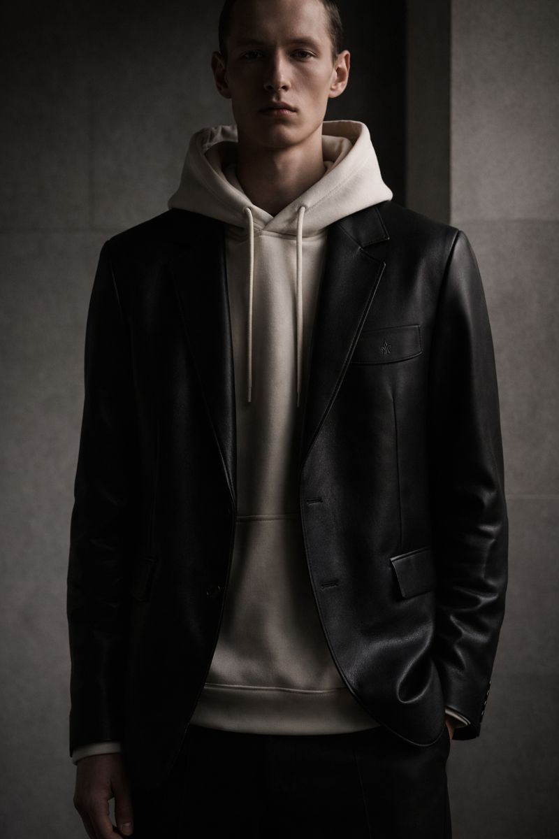 Leather blazer over cream hoodie